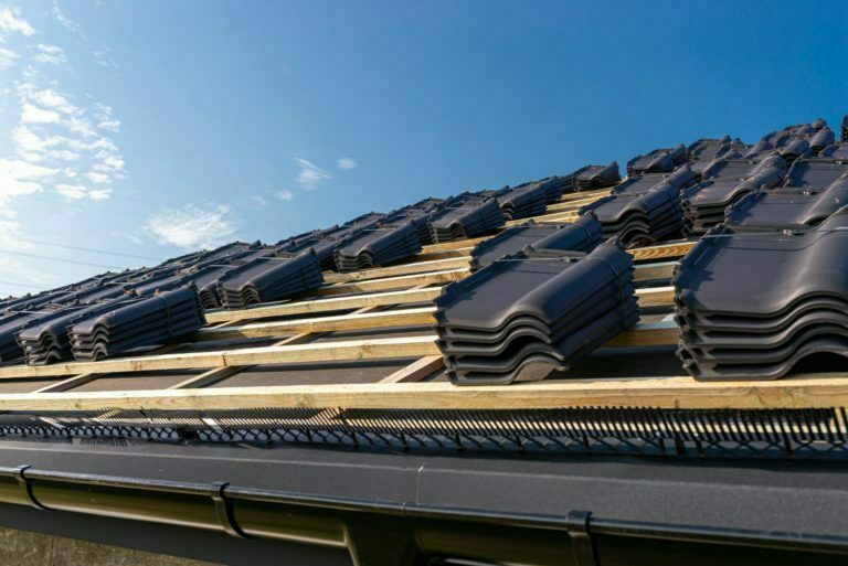 roof-ceramic-tile-arranged-in-packets-on-the-roof-2021-11-09-20-05-02-utc (1)